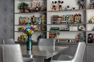 Inspiration for a mid-sized contemporary gender-neutral carpeted and wallpaper playroom remodel in New York with gray walls