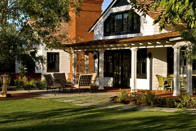 Example of a large classic white one-story wood exterior home design in Phoenix