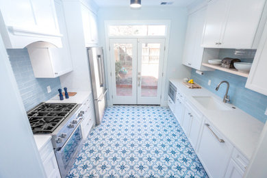 Inspiration for a small scandinavian galley ceramic tile and blue floor enclosed kitchen remodel in DC Metro with an undermount sink, recessed-panel cabinets, white cabinets, quartz countertops, blue backsplash, subway tile backsplash, stainless steel appliances and white countertops