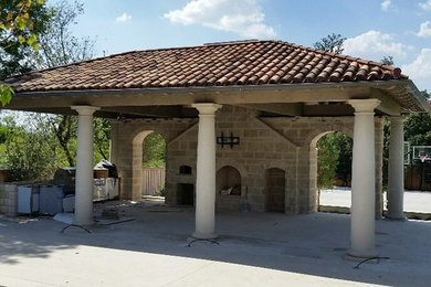 This is an example of a mediterranean porch design in Dallas.