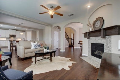 Design ideas for a transitional living room in Austin with a corner fireplace.