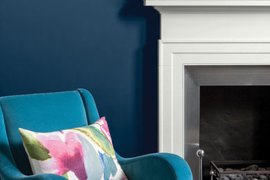 This is an example of a living room in Berkshire with blue walls.