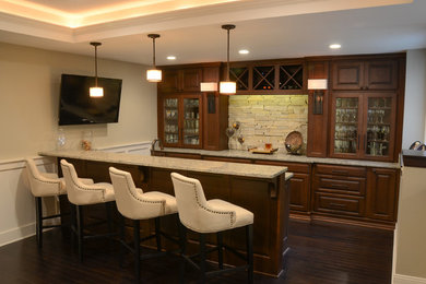Photo of a medium sized classic home bar in Milwaukee.