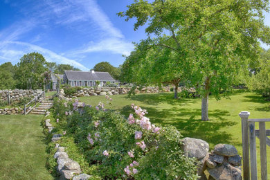 Photo of a farmhouse landscaping in Boston.