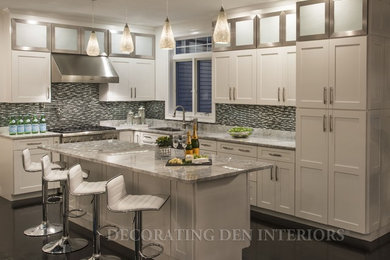 Inspiration for a large contemporary l-shaped dark wood floor eat-in kitchen remodel in Boston with an undermount sink, glass-front cabinets, white cabinets, granite countertops, gray backsplash, glass tile backsplash, stainless steel appliances and an island