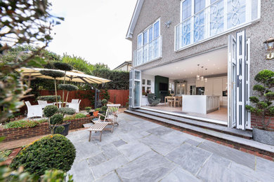 Patio - traditional patio idea in Surrey