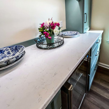 Custom Two-Toned Green and White Kitchen with Laventa Carrara Quartz Countertops