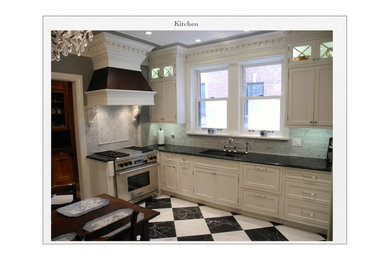 Example of a small classic u-shaped marble floor enclosed kitchen design in Chicago with an undermount sink, flat-panel cabinets, white cabinets, quartz countertops, gray backsplash, stone tile backsplash and stainless steel appliances