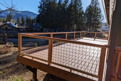 Example of a mountain style home design design in Portland