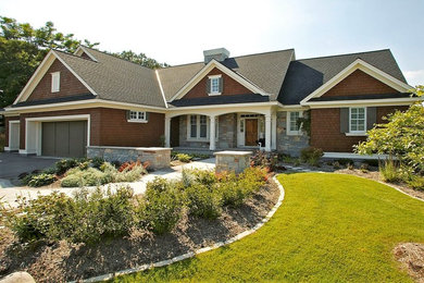 Inspiration for a two-story stone exterior home remodel in Minneapolis