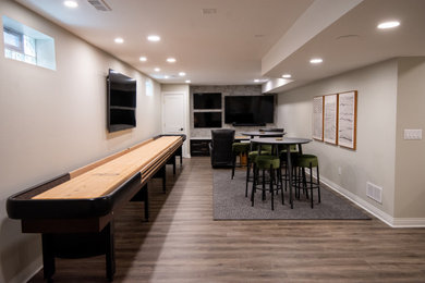 Inspiration for a modern wallpaper basement remodel in Milwaukee