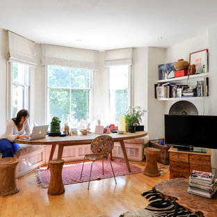 Photo of a mid-sized eclectic home design in London.