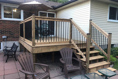 Deck - mid-sized backyard deck idea in Toronto with no cover