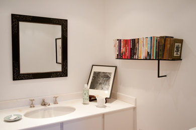 Bathroom - mid-sized traditional kids' bathroom idea in London with white walls and a drop-in sink