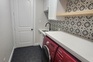 Example of a transitional laundry room design in Dallas