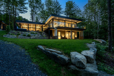 Inspiration for a mid-sized two-story wood and clapboard exterior home remodel in Montreal