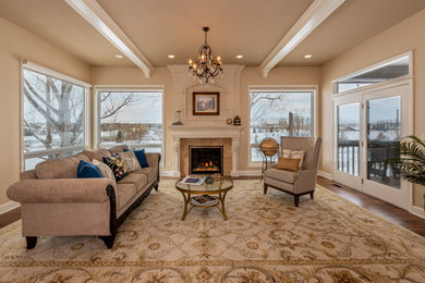 Inspiration for a timeless family room remodel in Denver with a concrete fireplace