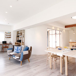 Mediterranean living room in Tokyo with white walls, painted wood flooring and grey floors.