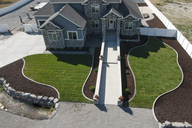 Design ideas for a large farmhouse full sun front yard concrete paver landscaping in Salt Lake City for spring.