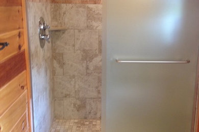 Example of a mid-sized 3/4 beige tile ceramic tile corner shower design in Other