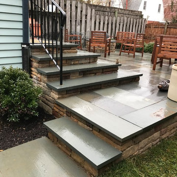 Removal of existing deck-Replaced with flagstone and E.P Henry Cast Wall