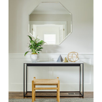 Geometric objects and a octagonal mirror offset the foyer