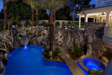 Island style pool photo in Phoenix
