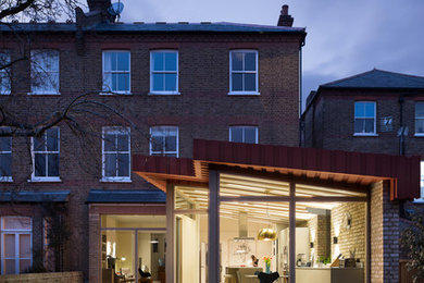 This is an example of a large contemporary three-storey exterior in London.