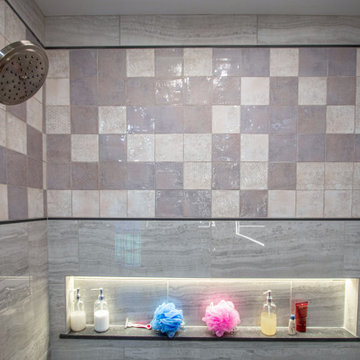Cream Primary Bath with Tiled Shower with LED Lighted Niche