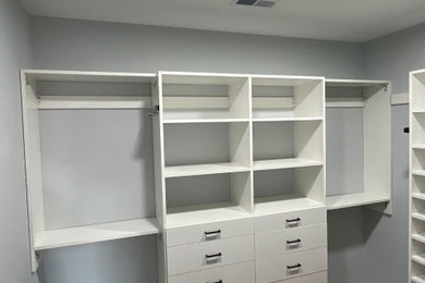 Example of a closet design in Indianapolis with white cabinets