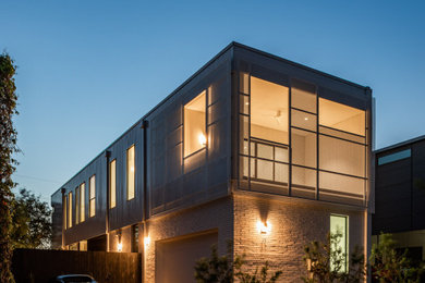 Large modern white two-story house exterior idea in Dallas