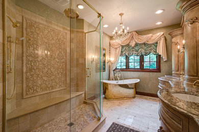 Bathroom - large mediterranean master beige tile and mosaic tile ceramic tile bathroom idea in Chicago with furniture-like cabinets, medium tone wood cabinets, beige walls, an undermount sink and granite countertops