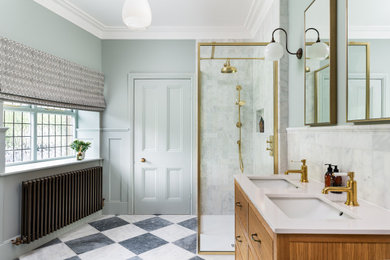 Photo of a large victorian family bathroom in Other with medium wood cabinets, a freestanding bath, a walk-in shower, marble tiles, marble flooring, a built-in sink, marble worktops, an open shower, feature lighting, double sinks, a freestanding vanity unit and panelled walls.