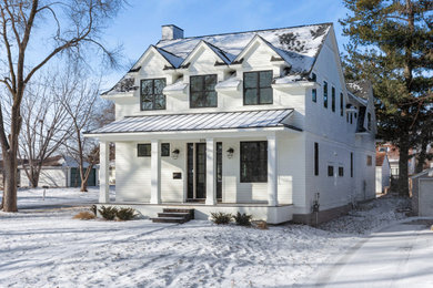 Inspiration for a large modern white two-story vinyl and clapboard exterior home remodel in Minneapolis with a shingle roof and a gray roof