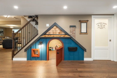 Kids' room - mid-sized traditional gender-neutral brown floor and medium tone wood floor kids' room idea in Ottawa with beige walls