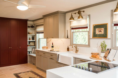 Mid-sized transitional l-shaped ceramic tile and multicolored floor eat-in kitchen photo in Philadelphia with a farmhouse sink, shaker cabinets, gray cabinets, quartzite countertops, multicolored backsplash, quartz backsplash, stainless steel appliances and white countertops