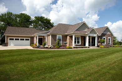Inspiration for a brown one-story mixed siding and clapboard house exterior remodel with a hip roof, a shingle roof and a brown roof