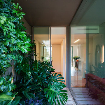 Cascais Glass Passage with Vertical Garden and Stone Paving