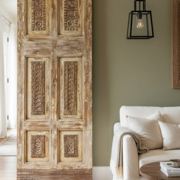 Antique Carved Barn Doors into a Spanish-Style Farmhouse