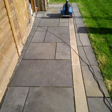 Refinishing a Black Limestone Patio After Installation in Cheltenham