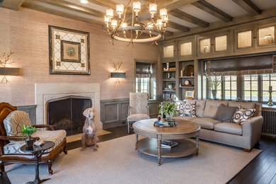 Example of a mid-sized transitional enclosed dark wood floor living room library design in Cincinnati with beige walls, a standard fireplace, a stone fireplace and a wall-mounted tv