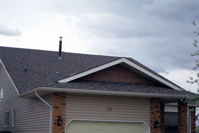 Beige two-story mixed siding exterior home idea in Calgary