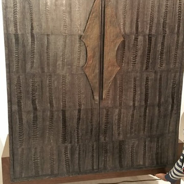 Ostrich clad armoire, wood base, artifact handles (work in progress)