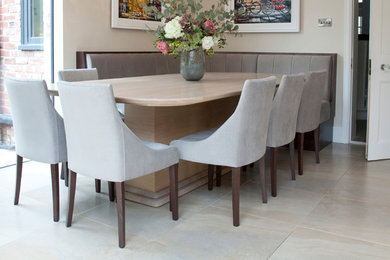 Design ideas for a contemporary kitchen/dining combo in Cheshire with porcelain floors.