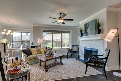 Mid-sized transitional open concept dark wood floor family room photo in Oklahoma City with gray walls, a standard fireplace and a stone fireplace