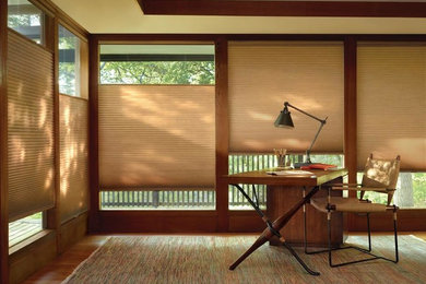 Mid-sized arts and crafts freestanding desk dark wood floor and brown floor study room photo in San Francisco with beige walls