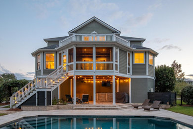 Example of an arts and crafts exterior home design in Charleston