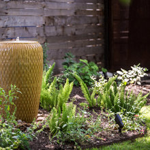 water feature in garden bed
