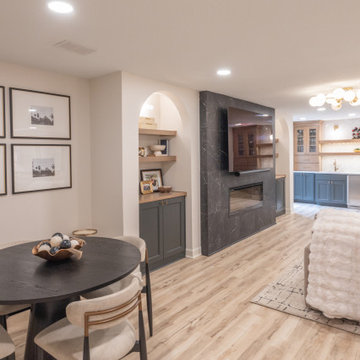 Warm & Inviting Basement Retreat with Custom Bar + Entertainment Center