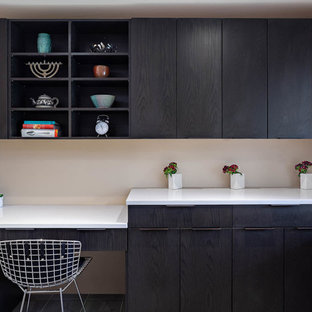 Modern desk area with open shelves.